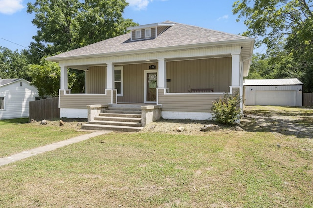 526 S Mccanse St, Mount Vernon, MO 65712 - bungalow-style home featuring a shingled roof, a porch, a front yard, and an outdoor structure