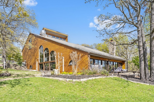 348 Sunset Cv Unit 413, Branson, MO 65616 - back of property featuring a yard and a chimney