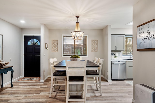 348 Sunset Cv Unit 413, Branson, MO 65616 - dining area with light wood-style flooring and a chandelier