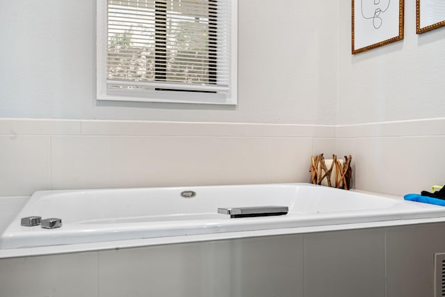 348 Sunset Cv Unit 413, Branson, MO 65616 - bathroom featuring a garden tub