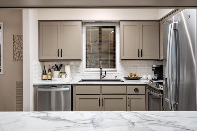 348 Sunset Cv Unit 413, Branson, MO 65616 - kitchen featuring appliances with stainless steel finishes, gray cabinets, and decorative backsplash