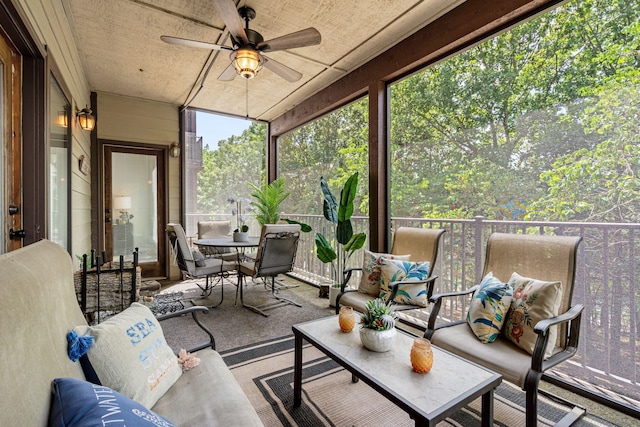348 Sunset Cv Unit 413, Branson, MO 65616 - sunroom / solarium featuring a ceiling fan, outdoor dining space, and an outdoor living space