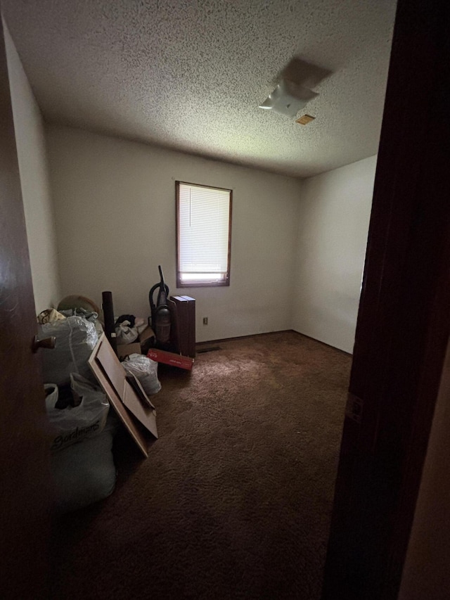 1334 E Nora St, Springfield, MO 65803 - unfurnished room with carpet floors and a textured ceiling