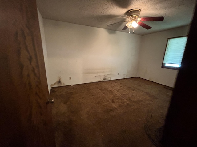 1334 E Nora St, Springfield, MO 65803 - unfurnished room featuring carpet floors, a textured ceiling, and a ceiling fan