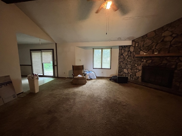 1334 E Nora St, Springfield, MO 65803 - unfurnished living room featuring ceiling fan, carpet floors, healthy amount of natural light, a stone fireplace, and vaulted ceiling