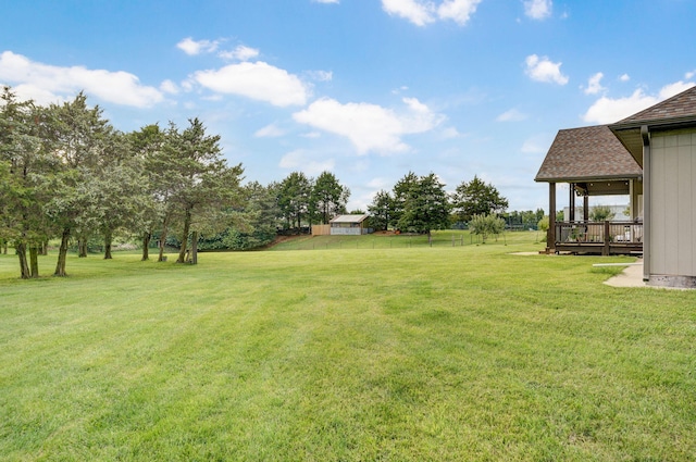4113 S Farm Rd Unit 223, Rogersville, MO 65742 - view of green lawn featuring a wooden deck