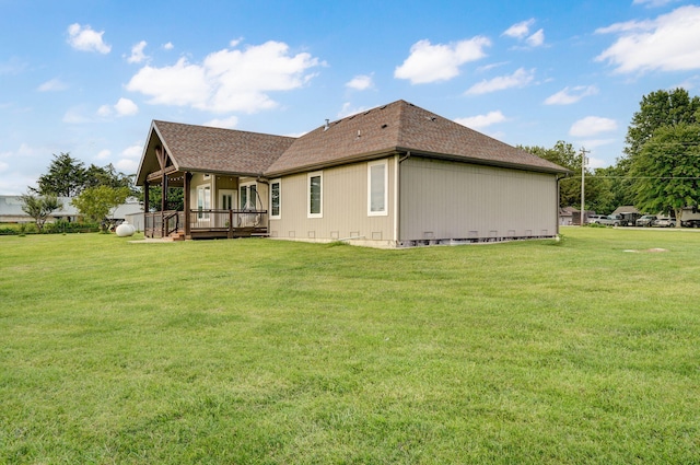 4113 S Farm Rd Unit 223, Rogersville, MO 65742 - back of property featuring a yard, a shingled roof, and a deck