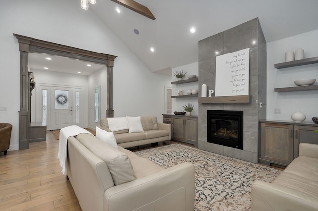 4113 S Farm Rd Unit 223, Rogersville, MO 65742 - living area featuring light wood-style floors, lofted ceiling, a tile fireplace, recessed lighting, and a ceiling fan
