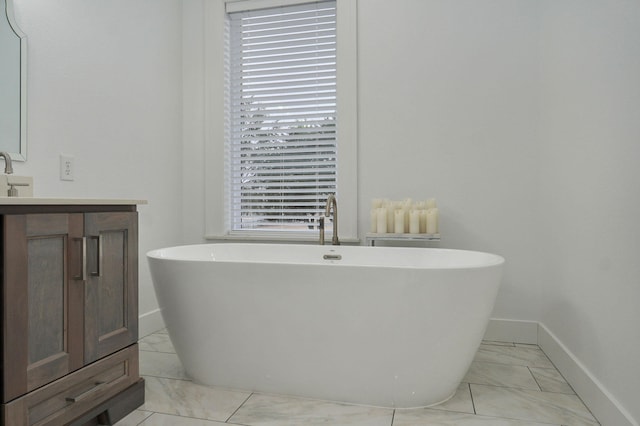 4113 S Farm Rd Unit 223, Rogersville, MO 65742 - bathroom featuring marble finish flooring, vanity, and a freestanding bath