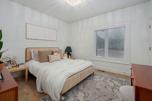 4113 S Farm Rd Unit 223, Rogersville, MO 65742 - bedroom featuring light wood-style floors and baseboards