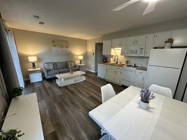 17 Fall Creek Trl Unit 4, Branson, MO 65616 - living area featuring dark wood-type flooring, ceiling fan, and a textured ceiling