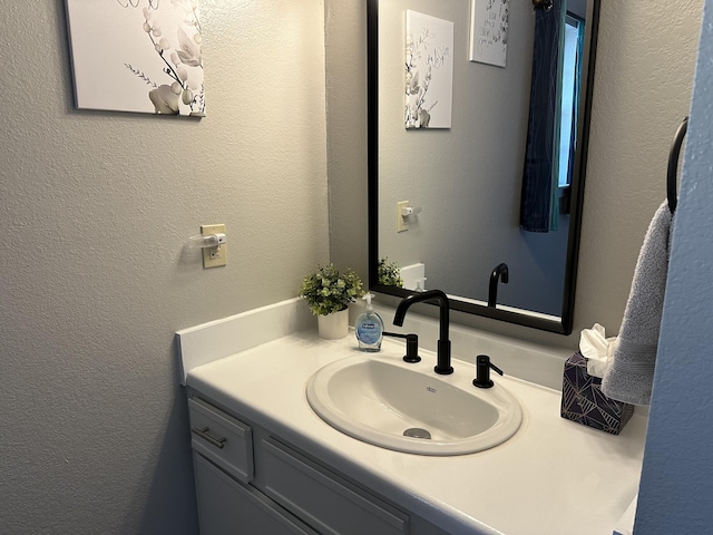 17 Fall Creek Trl Unit 4, Branson, MO 65616 - bathroom with vanity and a textured wall