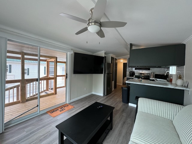 110 Blue-Bird Ln, Branson, MO 65616 - living room with ornamental molding, wood finished floors, and a ceiling fan