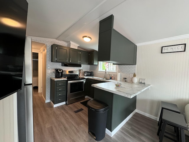 110 Blue-Bird Ln, Branson, MO 65616 - kitchen featuring electric stove, a peninsula, light countertops, under cabinet range hood, and dark wood-style floors