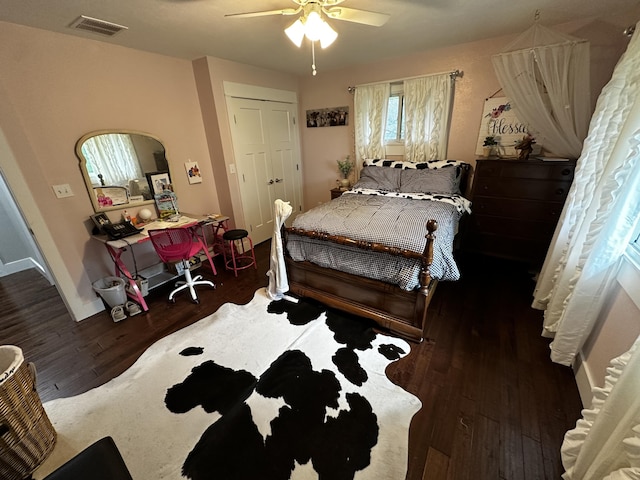 1179 N Pine St, Marshfield, MO 65706 - bedroom with wood finished floors, a ceiling fan, and arched walkways