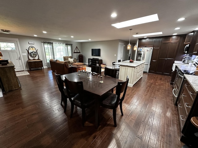 1179 N Pine St, Marshfield, MO 65706 - dining space with dark wood-type flooring, recessed lighting, and a skylight