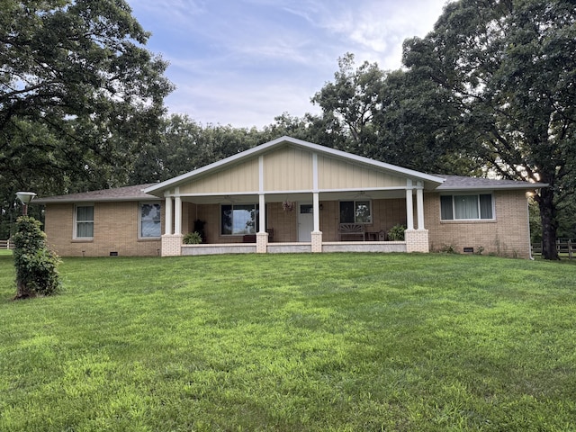 1179 N Pine St, Marshfield, MO 65706 - rear view of property with covered porch, brick siding, a yard, and crawl space