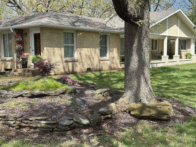 1179 N Pine St, Marshfield, MO 65706 - view of side of home featuring brick siding, roof with shingles, a yard, and covered porch