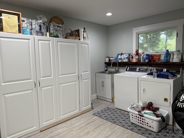 1179 N Pine St, Marshfield, MO 65706 - laundry room with independent washer and dryer, light wood finished floors, cabinet space, and recessed lighting