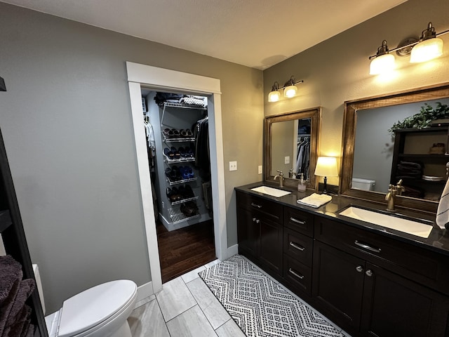 1179 N Pine St, Marshfield, MO 65706 - bathroom featuring double vanity and a spacious closet