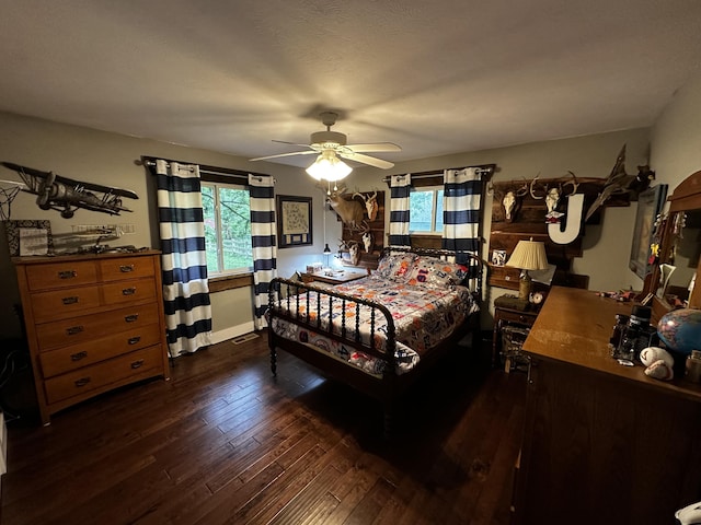 1179 N Pine St, Marshfield, MO 65706 - bedroom featuring multiple windows, hardwood / wood-style floors, and a ceiling fan