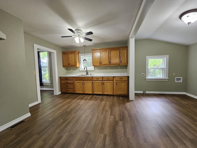 609 S College St, Neosho, MO 64850 - kitchen featuring brown cabinets, light countertops, healthy amount of natural light, and lofted ceiling