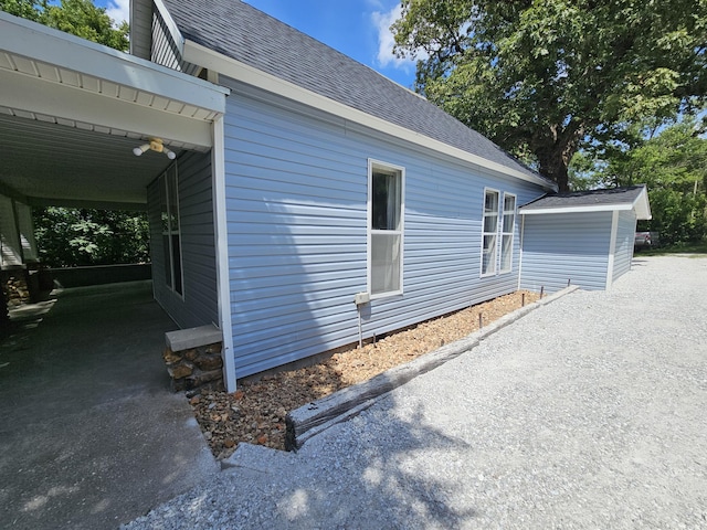 609 S College St, Neosho, MO 64850 - view of side of home featuring a shingled roof