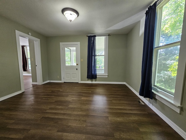 609 S College St, Neosho, MO 64850 - unfurnished room with dark wood-type flooring