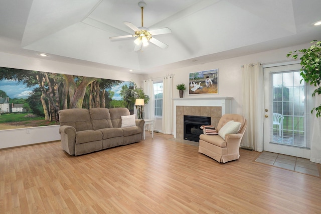 1060 Berkley, Marshfield, MO 65706 - living area featuring a fireplace, light wood finished floors, a ceiling fan, plenty of natural light, and vaulted ceiling