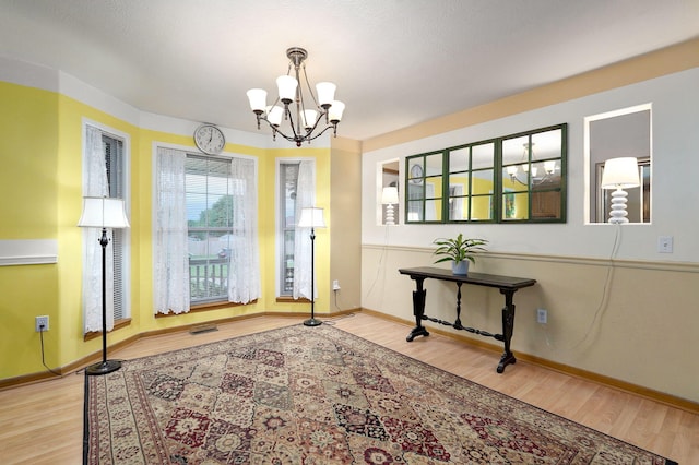 1060 Berkley, Marshfield, MO 65706 - entryway featuring wood finished floors and a chandelier