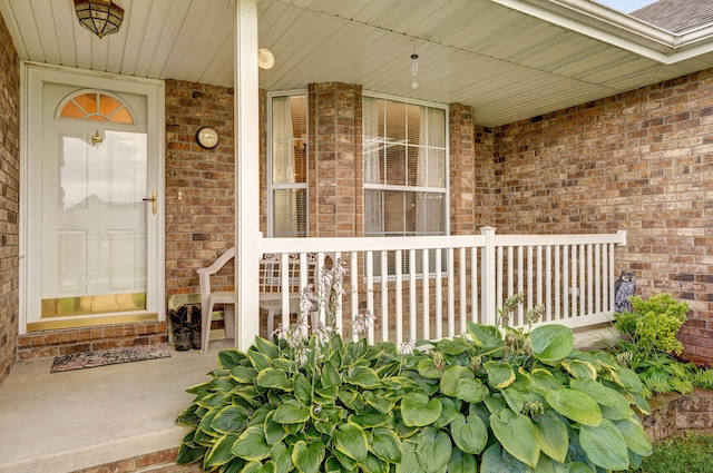1060 Berkley, Marshfield, MO 65706 - doorway to property with covered porch and brick siding