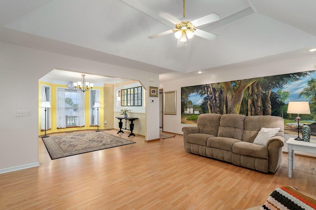 1060 Berkley, Marshfield, MO 65706 - living room with a chandelier, light wood-type flooring, lofted ceiling, arched walkways, and a ceiling fan