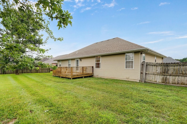 1060 Berkley, Marshfield, MO 65706 - back of property with a fenced backyard, a wooden deck, and roof with shingles