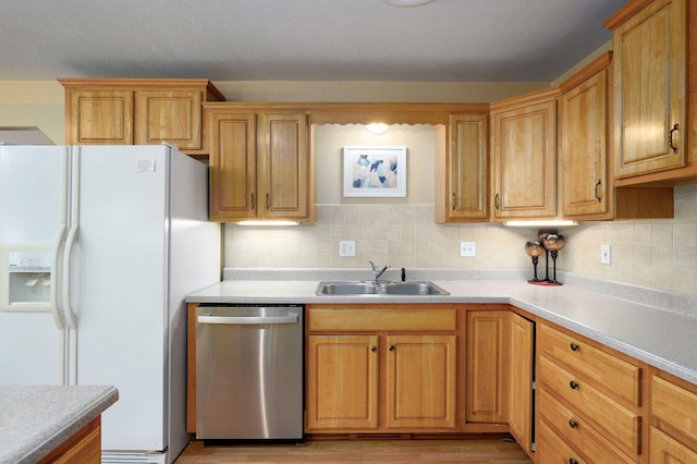 1060 Berkley, Marshfield, MO 65706 - kitchen featuring stainless steel dishwasher, white fridge with ice dispenser, light countertops, and tasteful backsplash