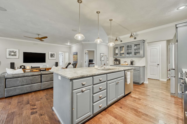 1251 S Rosemoor Dr, Nixa, MO 65714 - kitchen with gray cabinetry, a ceiling fan, an island with sink, stainless steel dishwasher, and ornamental molding
