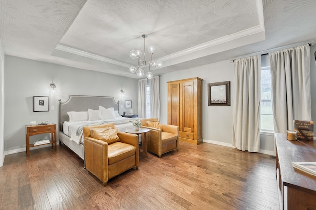 1251 S Rosemoor Dr, Nixa, MO 65714 - bedroom featuring a tray ceiling, hardwood / wood-style flooring, a chandelier, and crown molding