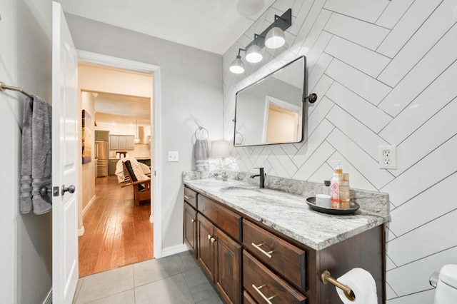 1251 S Rosemoor Dr, Nixa, MO 65714 - bathroom featuring vanity, decorative backsplash, and tile patterned floors