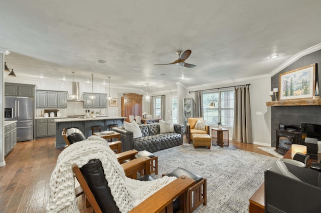 1251 S Rosemoor Dr, Nixa, MO 65714 - living room with ornamental molding, dark wood-style flooring, and ceiling fan