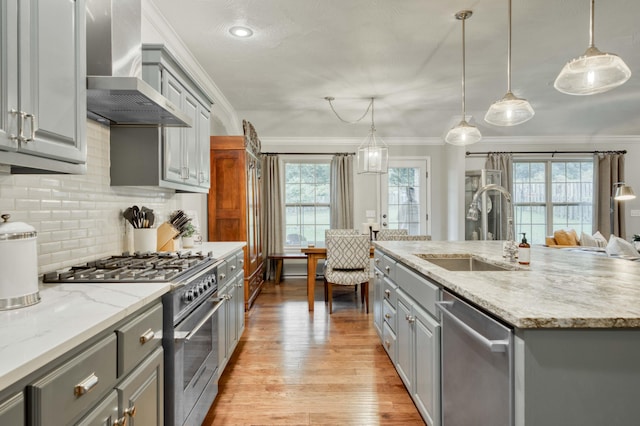 1251 S Rosemoor Dr, Nixa, MO 65714 - kitchen featuring gray cabinetry, appliances with stainless steel finishes, wall chimney exhaust hood, healthy amount of natural light, and ornamental molding
