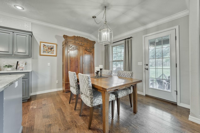 1251 S Rosemoor Dr, Nixa, MO 65714 - dining space featuring ornamental molding, a chandelier, and dark wood-type flooring