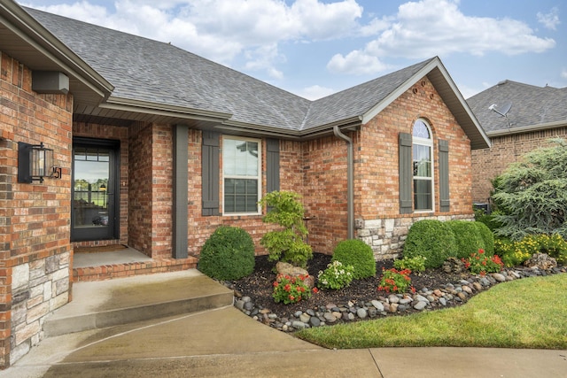 1251 S Rosemoor Dr, Nixa, MO 65714 - property entrance with a shingled roof and brick siding