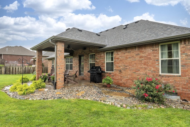1251 S Rosemoor Dr, Nixa, MO 65714 - rear view of property with roof with shingles, ceiling fan, a patio area, and brick siding