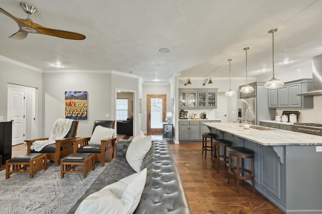 1251 S Rosemoor Dr, Nixa, MO 65714 - living room with dark wood-type flooring, ceiling fan, and ornamental molding
