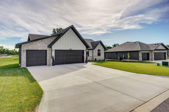 816 S Rockburn Ct, Nixa, MO 65714 - view of front facade with board and batten siding, a front lawn, concrete driveway, and a garage