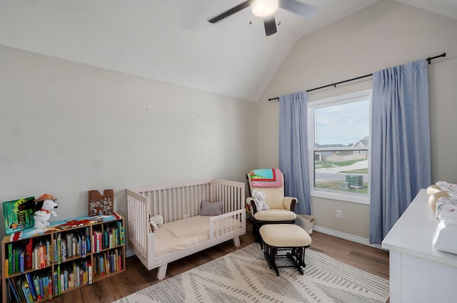 816 S Rockburn Ct, Nixa, MO 65714 - bedroom with vaulted ceiling, wood finished floors, a crib, and a ceiling fan