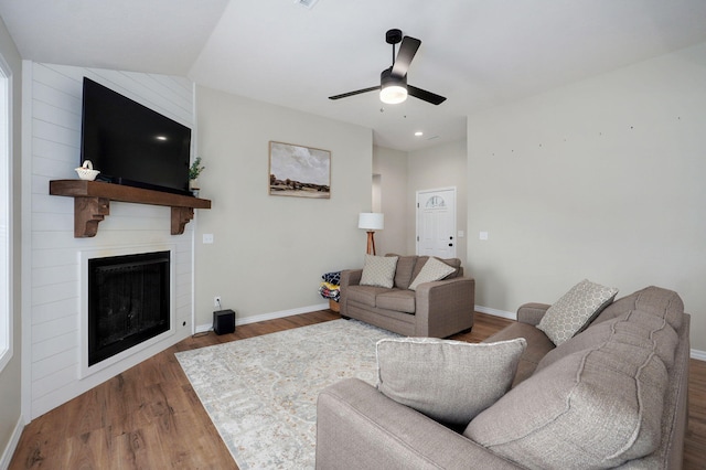 816 S Rockburn Ct, Nixa, MO 65714 - living room featuring wood finished floors, a fireplace, and ceiling fan