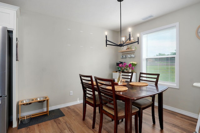 816 S Rockburn Ct, Nixa, MO 65714 - dining room featuring wood finished floors and a chandelier