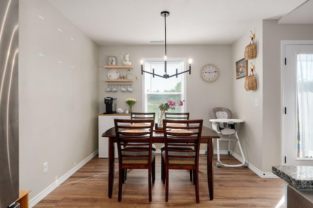 816 S Rockburn Ct, Nixa, MO 65714 - dining area with light wood-type flooring and healthy amount of natural light