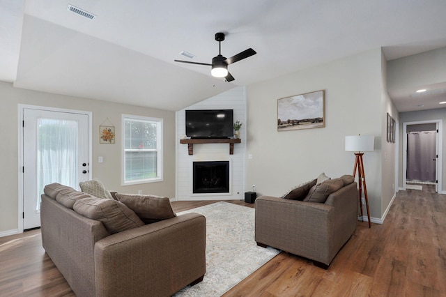 816 S Rockburn Ct, Nixa, MO 65714 - living room with wood finished floors, a ceiling fan, a large fireplace, and vaulted ceiling