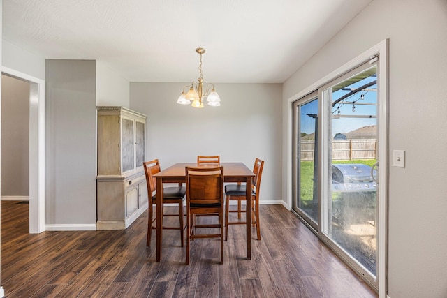 701 Lexington Cir, Clever, MO 65631 - dining space featuring a chandelier and dark wood-style floors